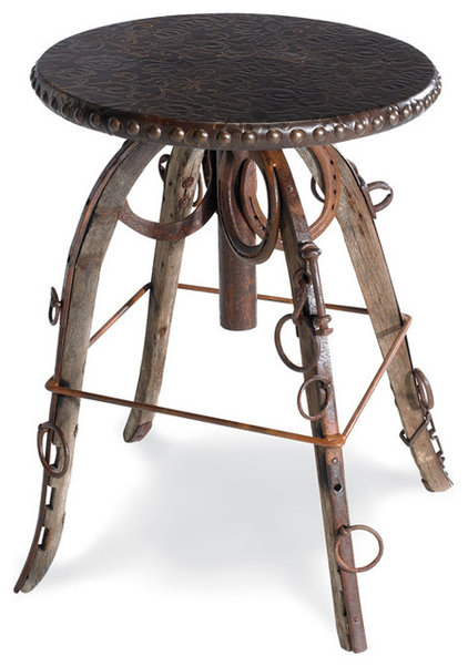 small, round, leather-topped side table with nailhead trim
