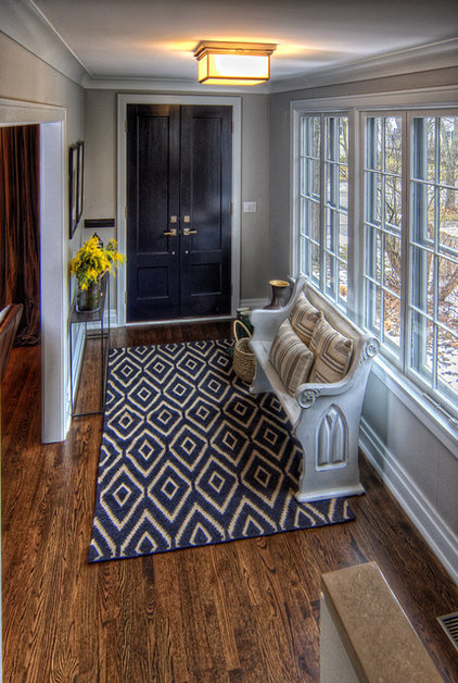 An antique church pew makes for perfect entryway seating