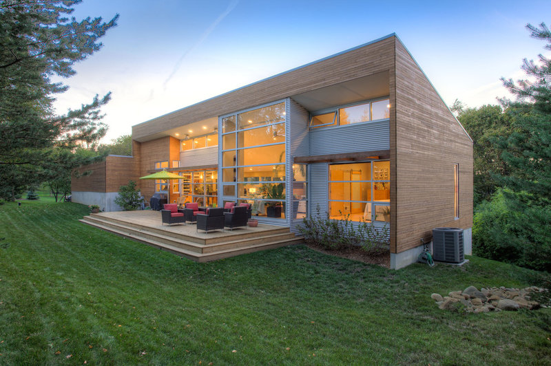 modern exterior by Genesis Architecture, LLC.