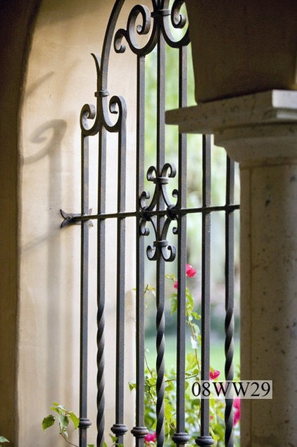 Row Of Windows With Wrought Iron Grills On Side Of Spanish Style ...