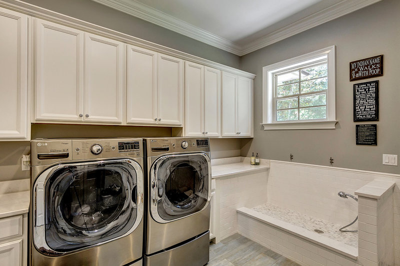 Traditional Laundry Room by Emerald Coast Real Estate Photography