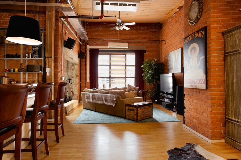 Industrial Living Room by AMR Design