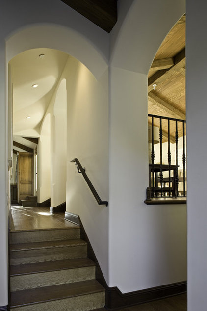 mediterranean staircase by Claudio Ortiz Design Group, Inc.