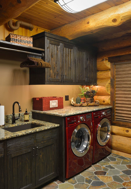 Rustic Laundry Room by Lake Country Builders
