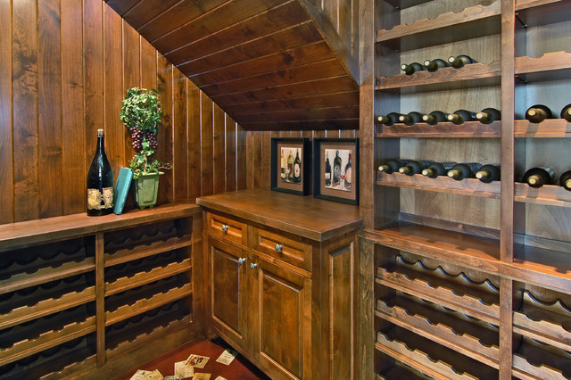 traditional wine cellar by John Kraemer & Sons