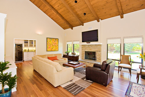 family room, stone masonry fireplace with flat TV, opens to butler pantry contemporary family room