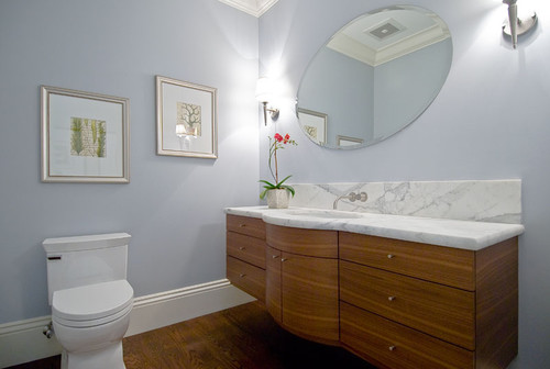 floating curved vanity with stained horizontal grain beech, marble counters contemporary bathroom