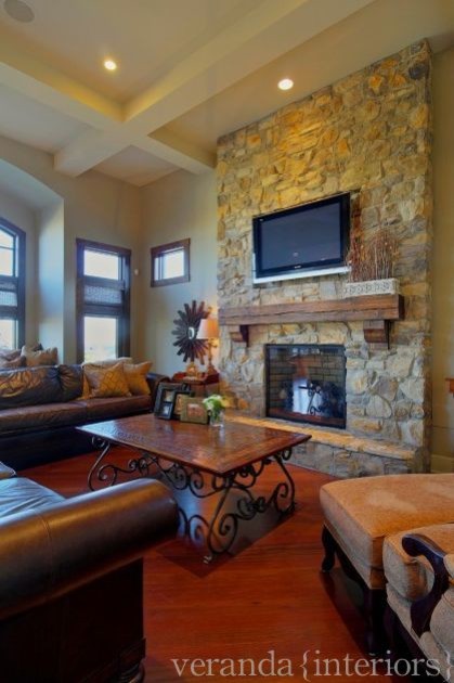 Stone fireplace w/ timber mantle  family room