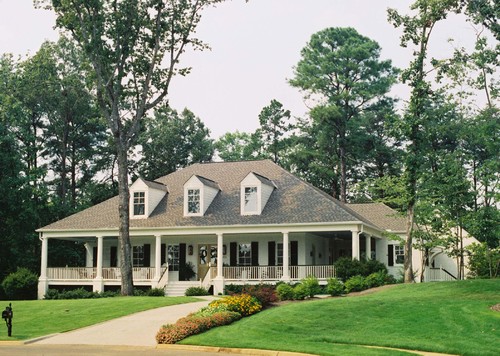 Acadian Style Home with wrap-around porch in Alabama traditional exterior