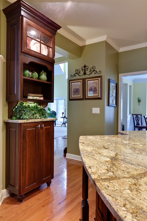 love the green paint with the cherry cabinets. will you ...