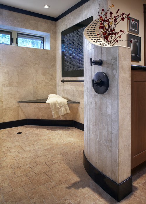 How is the black tile baseboard curved along the wall?