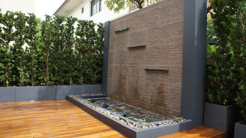 Gold Teak Deck with Modern Water-Wall Feature - Tropical ...