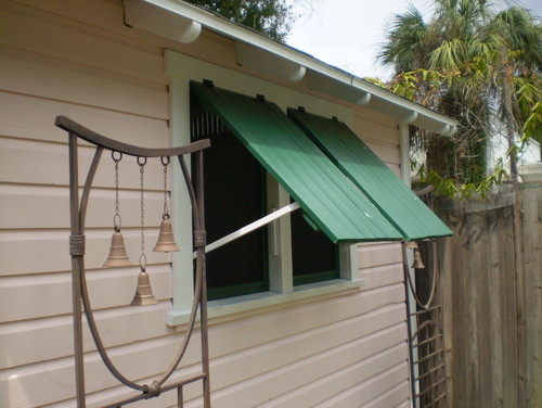 Shed with awning shutters