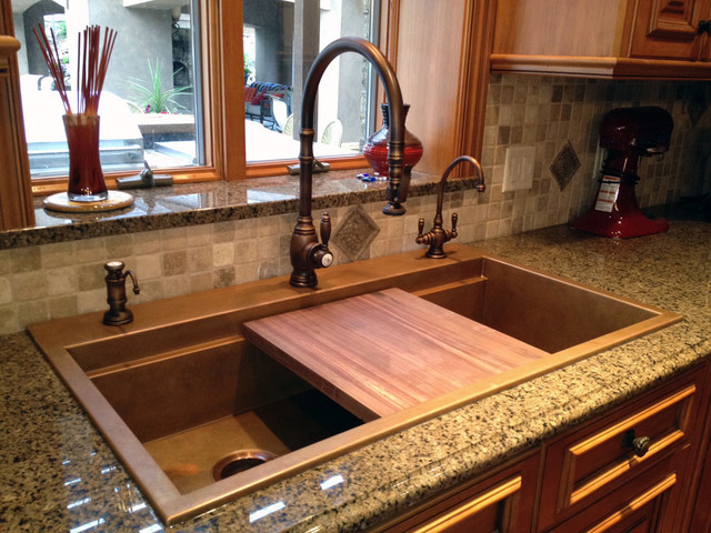 black kitchen sink with cutting board