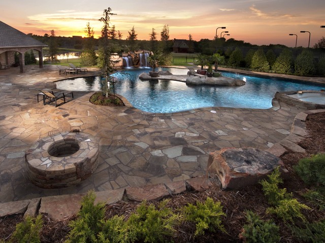 Glass tiled pool with a rustic island oasis in oklahoma for Pool design okc