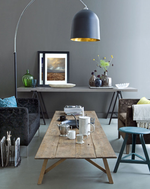home decor trend - floor lamp with gold-plated interior in the living room living room with floor lamp with gold-plated interior and wooden coffee table