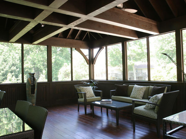 Screened Porch with Exposed Beams and Hardwood Floors - rustic ...