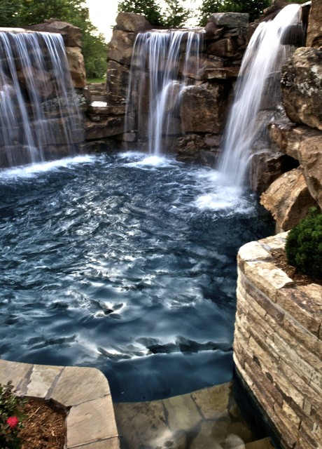 Multiple waterfalls and diving ledges highlight this for Pool design okc
