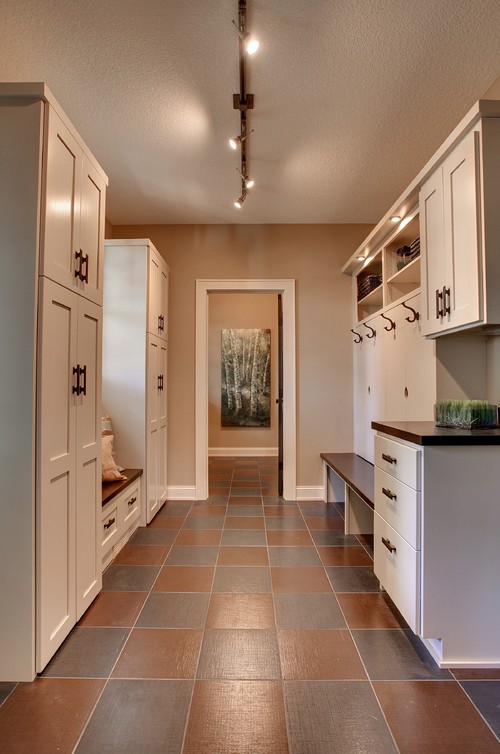 A track light is a smart idea for a mudroom. Photo credit: Traditional Laundry Room by Burnsville Design-Build Firms Highmark Builders