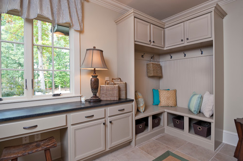 For a different take on mudroom lighting, add a table lamp! Photo credit: Traditional Laundry Room by Greenville Design-Build Firms Dillard-Jones Builders, LLC