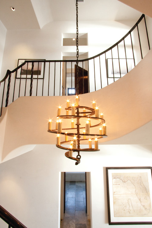 Hanging Chandelier In Two Story With Overlooking Railing