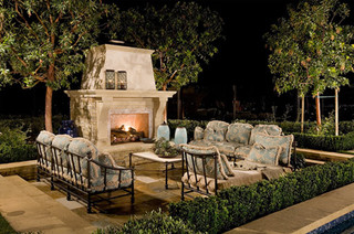 Outdoor fireplace with lots of seating.