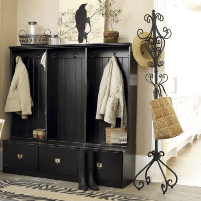 A coat closet and hat and bag rack Coat closet and hat rack