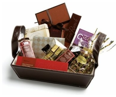 A gift basket filled with delectable chocolate is perfect for the holidays A gift basket filled with different kinds of chocolate