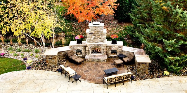 Poolside fireplace from balcony  Traditional  Patio  minneapolis  by Backyard 