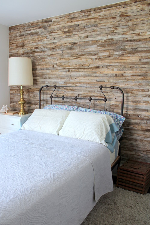 Planked wood wall with narrow, staggered wood planks for a bedroom.