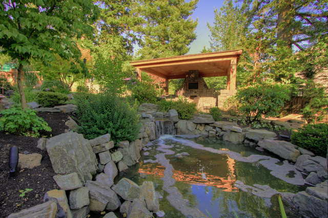 Outdoor living, gazebo, outdoor fireplace, water feature. traditional