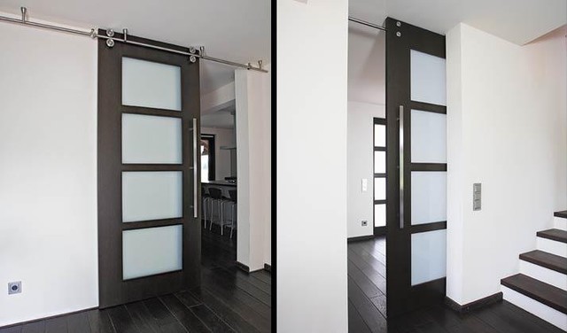 Floor-to-ceiling sliding door with twin-system barn door hardware ...