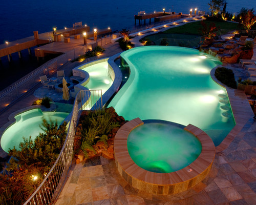Pool and lakehouse lighting ideas. Photo credit: Traditional Pool by The Woodlands Pools & Spas Texas Pools