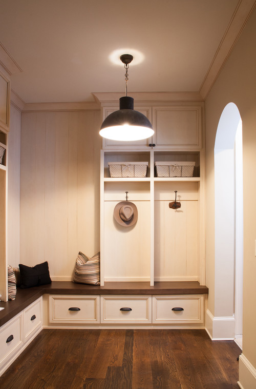 A pendant light like the Hudson Valley Lydney adds serious style to a mudroom. Photo credit: Traditional Entry by Cumming Kitchen & Bath Designers Keystone Millworks Inc