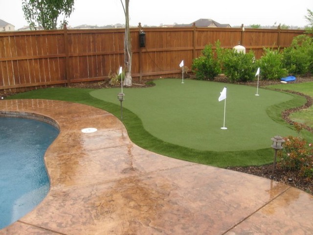 Personalized Synthetic Putting Green next to Pool and Patio