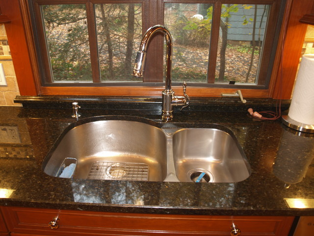 Traditionally warm cherry kitchen with working island traditional kitchen