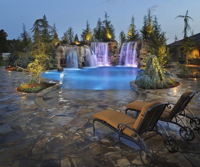 Waterfalls grottos give this oklahoma pool multiple for Pool design okc