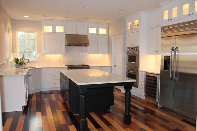 white kitchen with black island, multi-colored bamboo ...