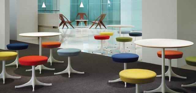 Collaboration area with Medici Chairs, Nelson Pedestal Stools and Table modern
