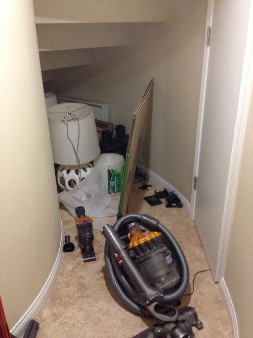 Small storage under curved staircase