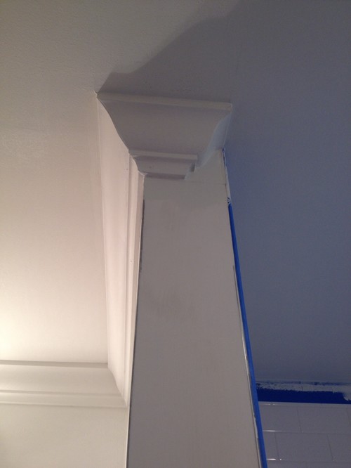 Crown molding transitions against tile shower