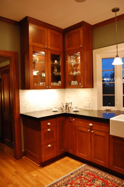 Cabinetry with glass shelving and interior lighting traditional-kitchen