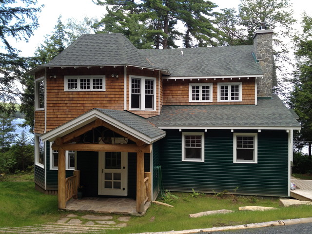 Addition on Gambrel roof home rustic-exterior