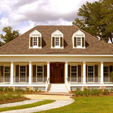 Full wrap around porch, hip roof, dormers, on stilts