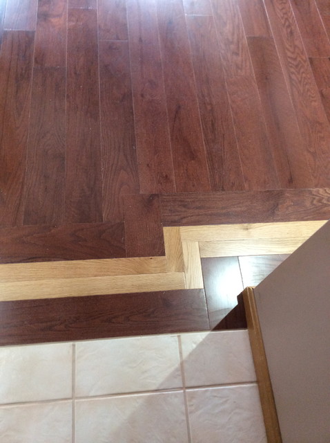 Two tone hardwood floor with mosaic inlay