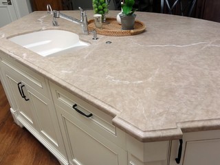 kitchen island with beige marble countertop