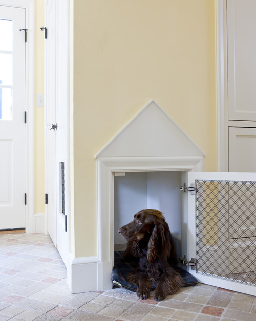 Must see adorable built-in dog crate framed like a mini-me house.