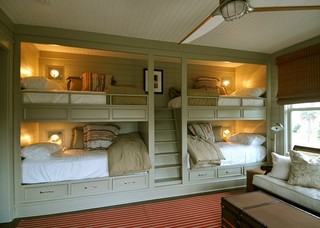 Cool bunk room with lights and storage for each of the 4 beds.