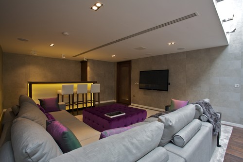 cinema room with purple buttoned pouff