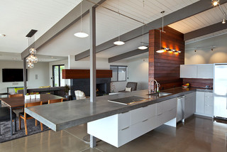 modern kitchen island with grey concrete countertop